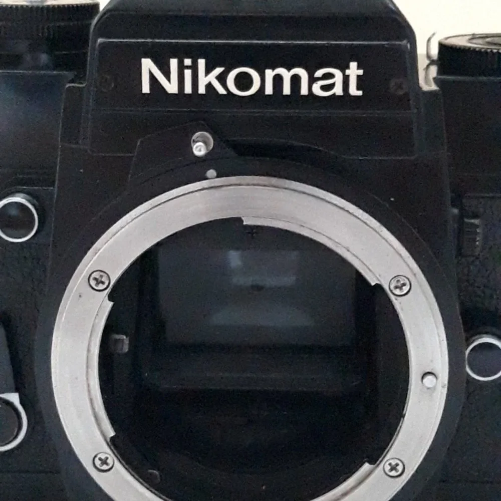 Nikon Nikkomat EL Nikkor 35-80mm 4-5.6D Zoom lens. Leather case